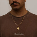 Cadena larga Cartier de 2 mm con colgante de Jesucristo bañada en oro de 18 quilates